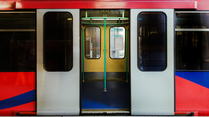 Open doors of a modern subway train showing interior compartment
