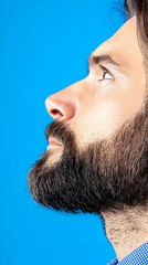 Man's Profile, Gazing Upward, Blue Background, Studio