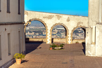 Bridge ramp with walkway over the main entrance to the drill ground of the fortress Castel Sant'Elmo in Naples, the fortress that towers high on the Vomero hill, above the city of Naples.