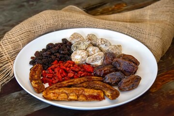Group of dehydrated dried fruits, dates, goji berries, raisins, dried bananas and Turkish figs. Superfood