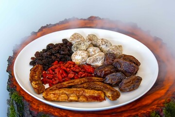 Group of dehydrated dried fruits, dates, goji berries, raisins, dried bananas and Turkish figs. Superfood