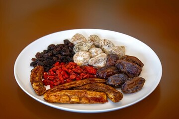 Group of dehydrated dried fruits, dates, goji berries, raisins, dried bananas and Turkish figs. Superfood