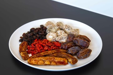 Group of dehydrated dried fruits, dates, goji berries, raisins, dried bananas and Turkish figs. Superfood