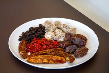 Group of dehydrated dried fruits, dates, goji berries, raisins, dried bananas and Turkish figs. Superfood