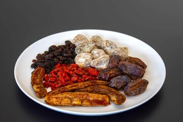 Group of dehydrated dried fruits, dates, goji berries, raisins, dried bananas and Turkish figs. Superfood