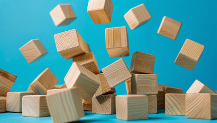 Whimsical illustration featuring wooden blocks in mid-tumble with a bright blue background; capturing the essence of playful instability and creative expression.  