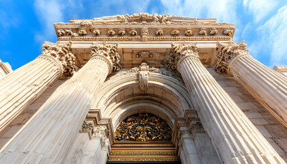 Fototapeta premium Ornate building facade, columns, arch, city, sunny sky
