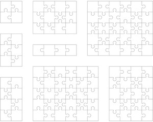 Separate pieces of eight white jigsaw puzzles 
