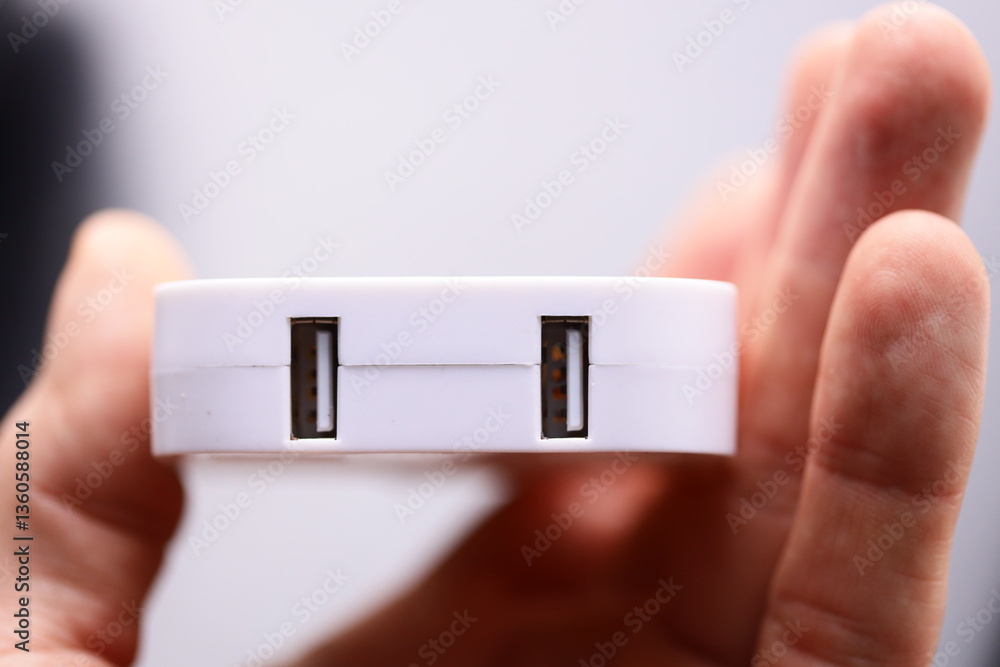 Poster a person holding a white device, suitable for tech-related illustrations and presentations.