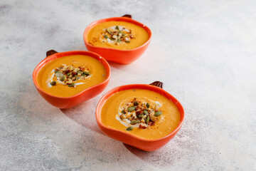 Traditional autumn butternut squash soup with seeds.