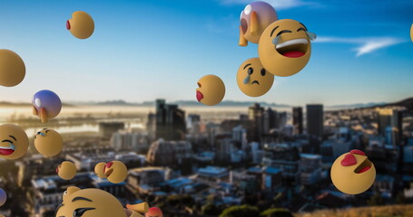 Emojis floating over cityscape at sunrise, expressing various emotions