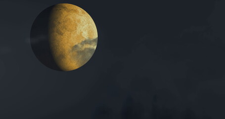 Golden moon glowing against dark sky with clouds creating mysterious atmosphere