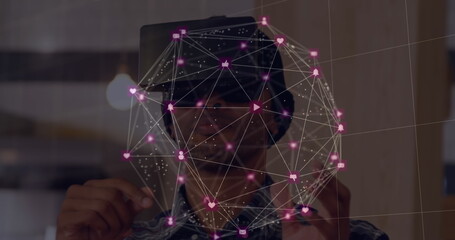 Man using virtual reality headset interacting with digital network interface
