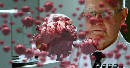 Scientist in laboratory examining virus model, focusing on research and analysis