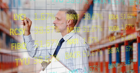 Image of stock exchange numbers over man counting stock in warehouse holding clipboard