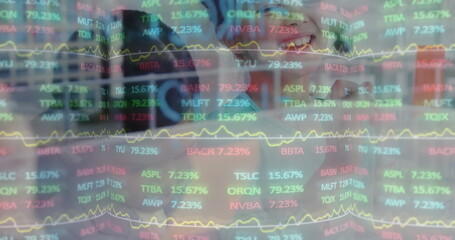 Smiling professional analyzing digital stock market data on transparent interface