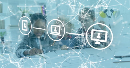 In school, children exploring digital interfaces, learning technology concepts together