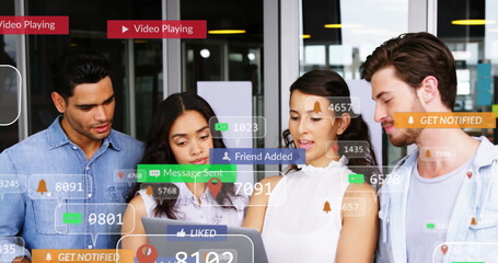 Image of social media text on banners with digital icons over people using laptop