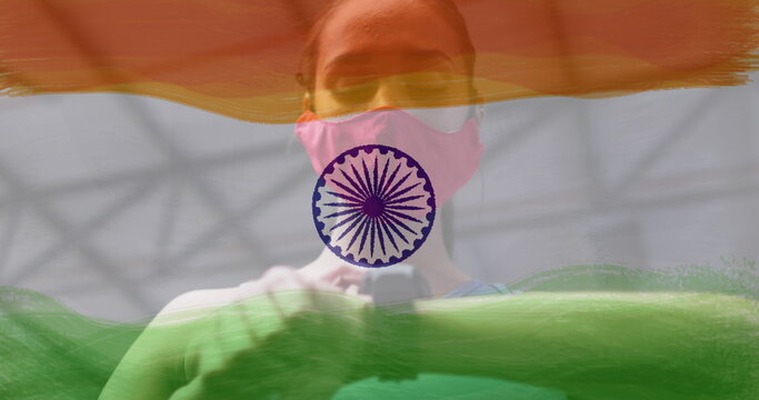 Image of woman wearing face mask during exercise over indian flag