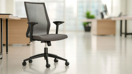 Modern ergonomic office chair with wheels displayed on a polished office floor with a neat desk and organizer in the background