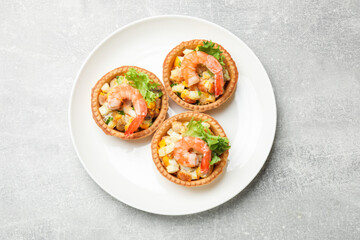 Tartlets with delicious filling on grey table, top view