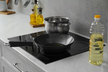 Frying pan with cooking oil in kitchen