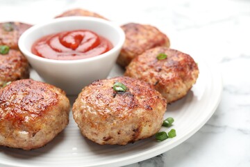 Delicious patties served on white table, closeup