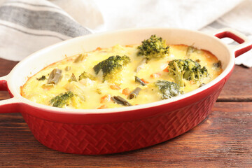 Delicious vegetable casserole on wooden table, closeup