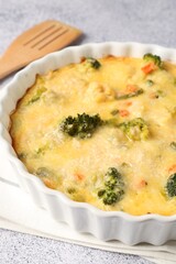 Delicious vegetable casserole on light table, closeup