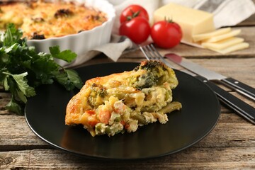 Tasty vegetable casserole on wooden table, closeup