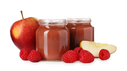 Baby food. Tasty puree in glass jars, fresh apples and raspberries isolated on white