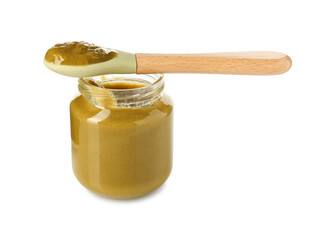 Baby food. Tasty puree in glass jar and spoon isolated on white