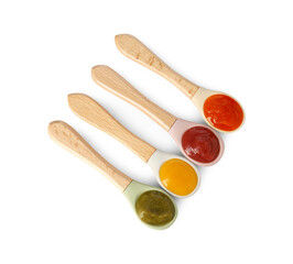 Baby food. Spoons with tasty puree on white background, top view