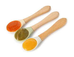 Baby food. Spoons with tasty puree on white background, above view