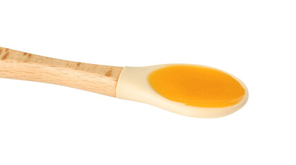 Baby food. Tasty puree in spoon isolated on white