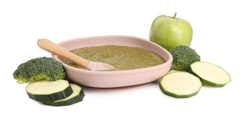 Baby food. Tasty puree in bowl, spoon and ingredients isolated on white