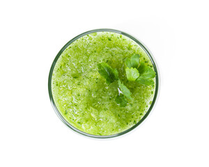 Healthy parsley smoothie in glass isolated on white, top view