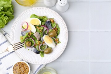 Delicious salad with herring, egg, mustard and vegetables served on white tiled table, flat lay....
