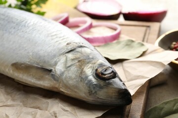 Salted herring and spices on table, closeup
