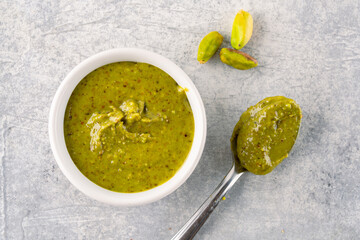 Delicious pistachio butter on white background