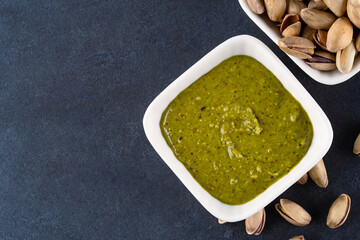Delicious pistachio butter on black background