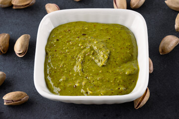 Delicious pistachio butter on black background