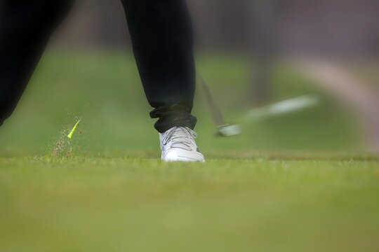 Golf tee shot, blured because of motion