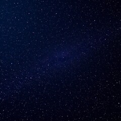 Fototapeta premium The vast dark celestial canvas filled with distant shining stars