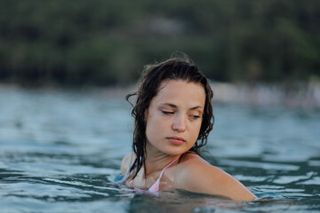 woman at resort in sea swimming and enjoying