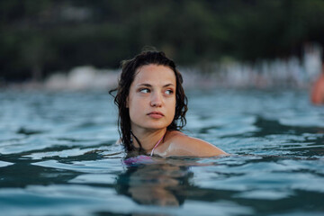 woman at resort in sea swimming and enjoying