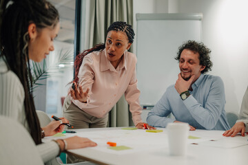 Fototapeta premium Team collaborating in a modern office setting