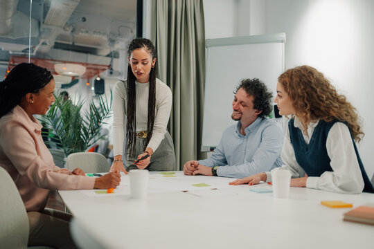 Diverse team engaging in creative meeting discussion