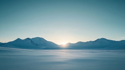 Arctic sunrise over snow-covered mountains.
