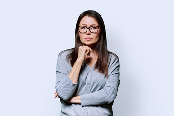 Portrait of serious business mature woman on white background